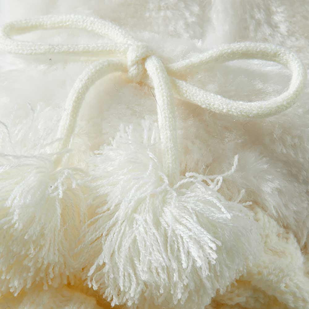 Couvre-jambes de fête en fourrure avec pompon